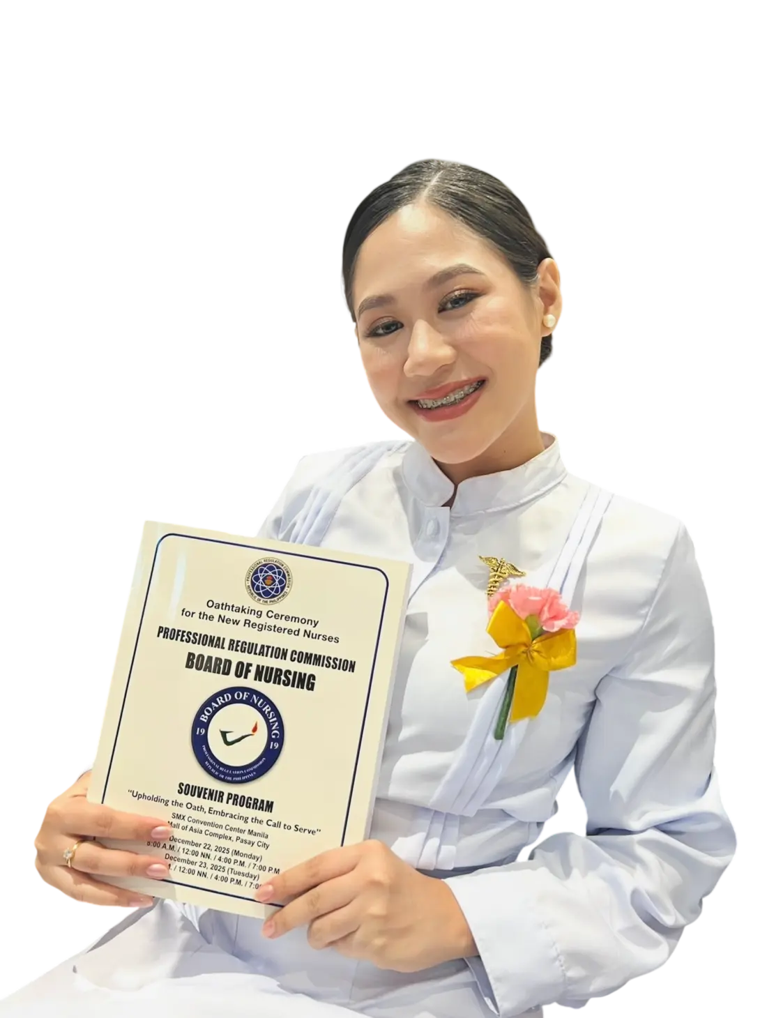 Ladylourds M. Diokno in her nursing uniform holding her oath-taking program